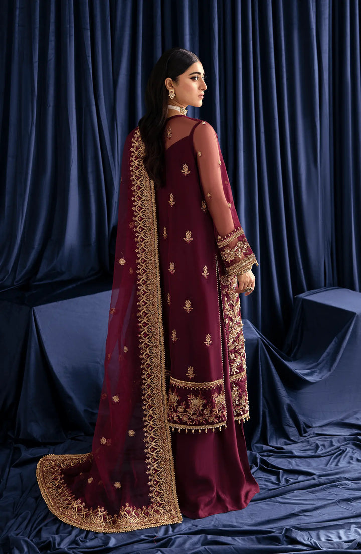 Raya maroon dress Back view of  featuring a subtle open-back design and secure zip closure, adding a touch of sophistication