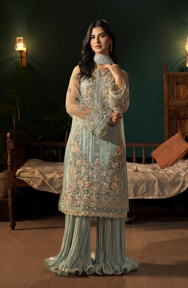 Model in front pose wearing Aquamarine Dress by Fabiha Fatima