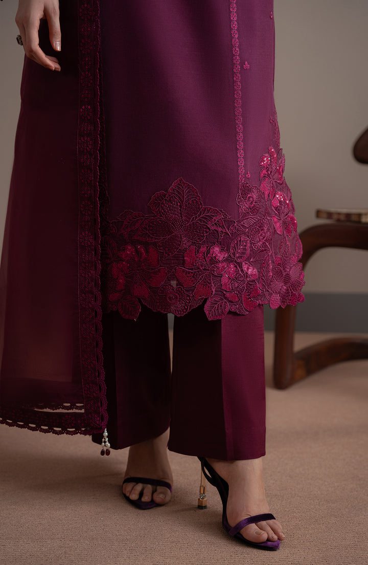 Person wearing a burgundy outfit with floral lace details on a neutral background| Elvin Collection by fabiha fatima